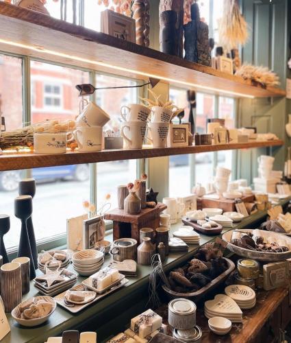 a display case in a store filled with lots of food at The Goose lodge in Calveley