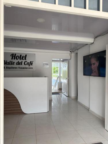 a lobby with a hotel awhile old cut out on the wall at Hotel Valle del Café - Habitación 1 Matrimonial in Sevilla