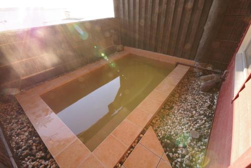 a small pool of water in a house at SHIRETOKO Kokun Kekun in Shari
