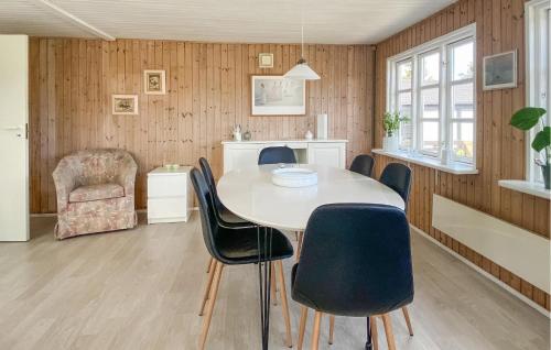 a kitchen and dining room with a table and chairs at Holiday Home Børkop With Sea View Vi in Børkop