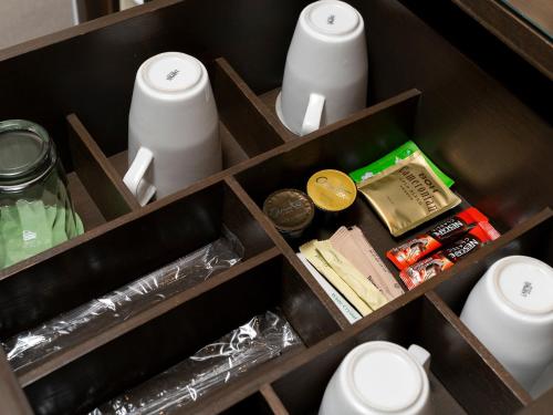 a drawer filled with toilet paper and other items at Olive Tree Hotel Penang in Bayan Lepas