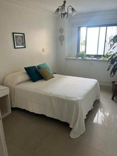 Ένα ή περισσότερα κρεβάτια σε δωμάτιο στο Crisostomo departamento