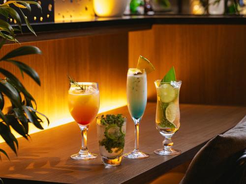 a group of four drinks sitting on a table at Glamday Style Okinawa Yomitan Hotel & Resort in Yomitan