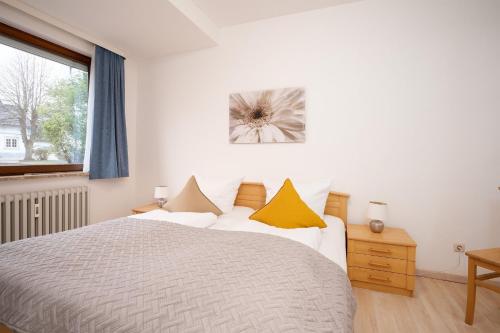 Postel nebo postele na pokoji v ubytování Haus Seebrise- Wohnung 7