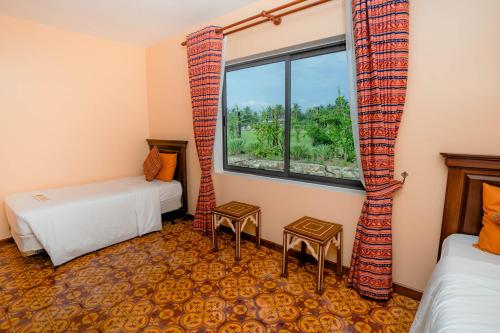 Postel nebo postele na pokoji v ubytování Komsan Kampot Resort