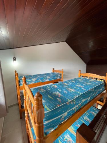 En eller flere senge i et værelse på Lar da Praia Casa4