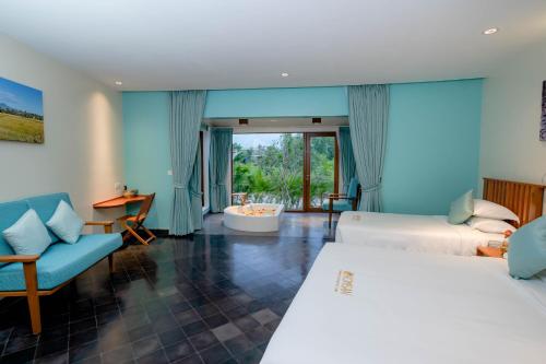 Postel nebo postele na pokoji v ubytování Komsan Kampot Resort
