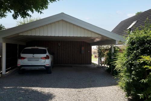 a white car parked in a garage at Twinhus Süssau in Süssau