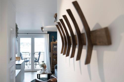 a hallway with a living room and a dining room at Residenz am Yachthafen Seaside Marina in Neustadt in Holstein