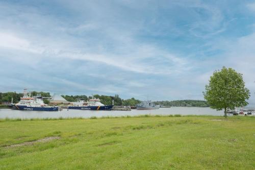a couple of boats docked in a body of water at Residenz am Yachthafen Seaside Marina in Neustadt in Holstein