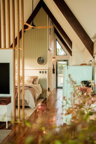 a bedroom with a bed and a tv in a room at Skyfarm Retreat in Cradoc