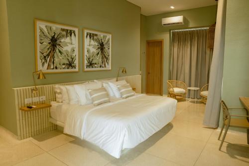 Ένα ή περισσότερα κρεβάτια σε δωμάτιο στο Terrazas Hotel Boutique