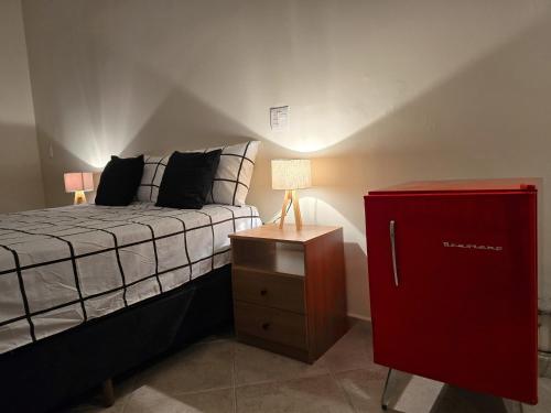 Hospedagem Central Curitiba - O seu lar longe de casaにあるベッド
