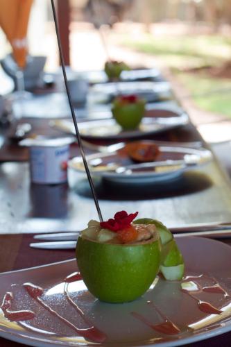 a row of plates of food on a table at Naledi Lodges in Balule Game Reserve