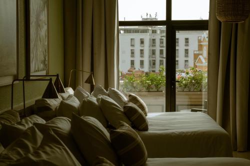 Ένα ή περισσότερα κρεβάτια σε δωμάτιο στο Terrazas Hotel Boutique