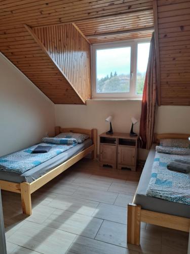 Posteľ alebo postele v izbe v ubytovaní MALIBU APARTMENT BALATON NORTH