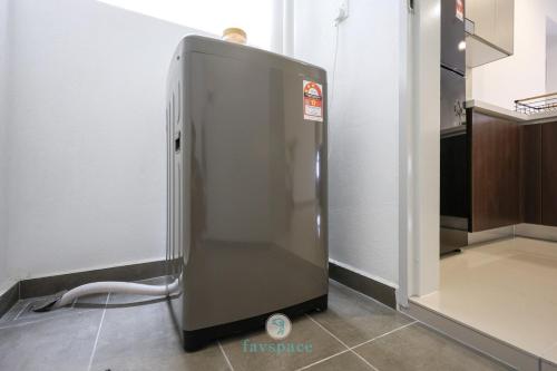 a stainless steel refrigerator in a kitchen with a scale at Jalan Puchong - 3B2B - 7 pax - 7 min to AEON BiG & Train in Puchong