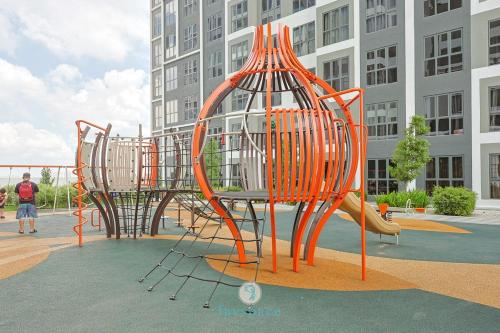 a playground with a slide in front of a building at Jalan Puchong - 3B2B - 7 pax - 7 min to AEON BiG & Train in Puchong