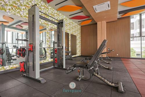 a gym with cardio equipment in a building at Jalan Puchong - 3B2B - 7 pax - 7 min to AEON BiG & Train in Puchong