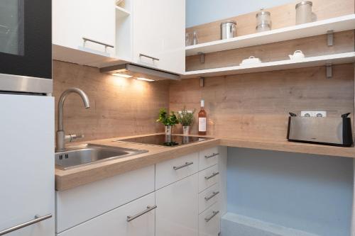 Kuchyň nebo kuchyňský kout v ubytování Solymar Wohnung 22