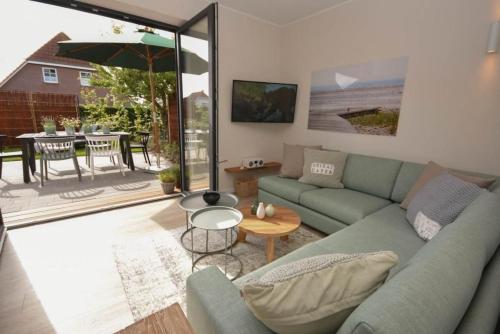 a living room with a couch and a table at Heimathafen Dahme in Dahme