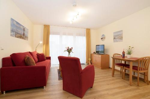 TV a/nebo společenská místnost v ubytování Lindenbuschen 2 Wohnung 6