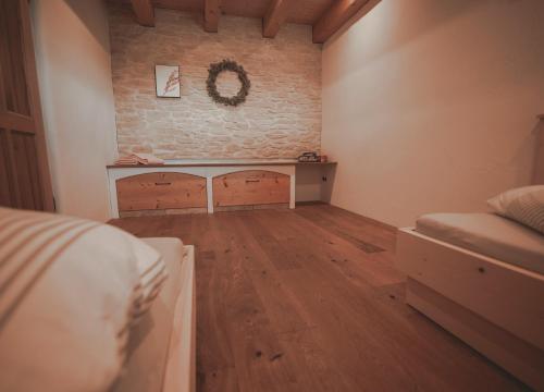 a room with two beds and a table in it at Ferienhaus Kaiser in Aßling