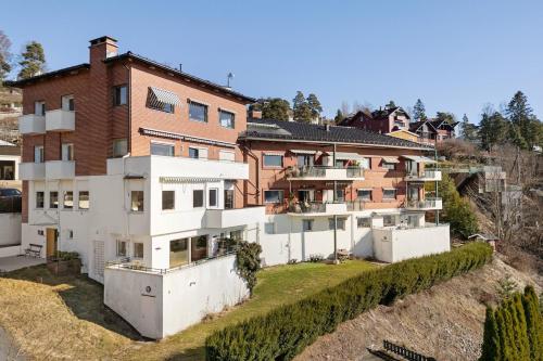 an apartment building on the side of a hill at Exclusive Oslo Fjord Apartment in Oslo