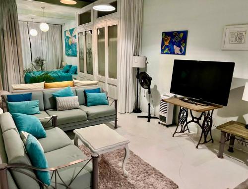 Televisyen dan/atau pusat hiburan di Casa loft con alberca