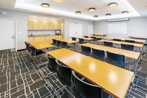an empty classroom with desks and chairs in it at TownePlace Suites by Marriott Tulsa Broken Arrow in Broken Arrow