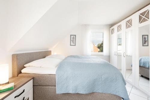 Postel nebo postele na pokoji v ubytování Strandresidenz Wohnung 7