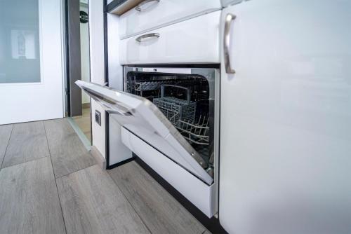 a dishwasher with its door open in a kitchen at Mija in Süssau