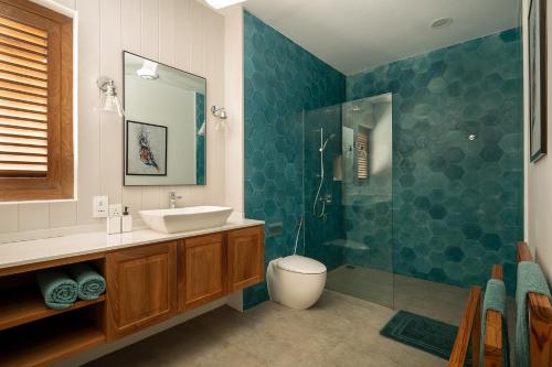 a bathroom with a sink and a shower at Kalkudah Beach House in Batticaloa