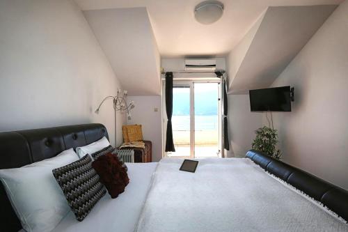 Кровать или кровати в номере Apartments Villa Kukoljac