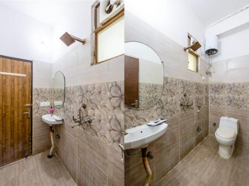 ノイダにあるHotel Vibe BLUE-Noida Sector 117の洗面台、トイレ、鏡のあるバスルーム