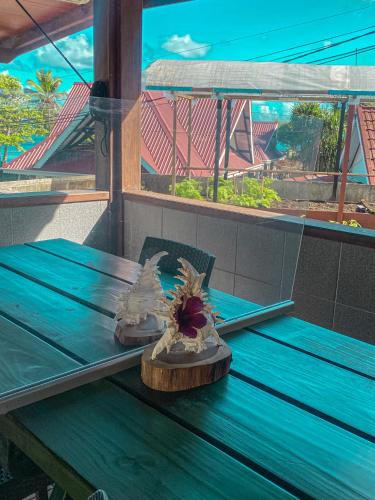 a pair of shoes sitting on a blue table at Divers Lodge Guest House in Beau Vallon
