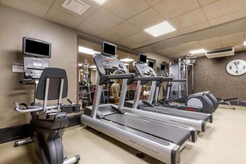 a gym with rows of treadmills and cardio machines at Curtiss Hotel, an Ascend Collection Hotel in Buffalo
