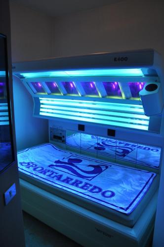 a bed with blue lights on top of it at Liberty Hotel Malé in Malè