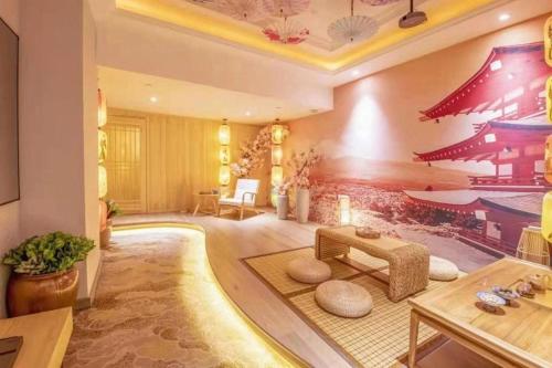 a living room with a large room with red walls at Yantai Bihai Hotel in Yantai