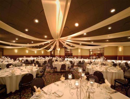 a large banquet hall with white tables and chairs at Blue Chip Casino Hotel Spa in Michigan City