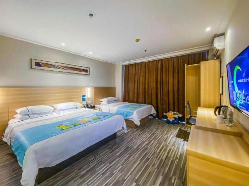 Letto o letti in una camera di City Comfort Inn Nanning Railway Station