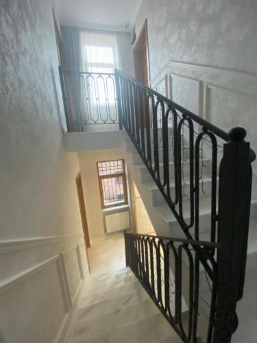 a spiral staircase in a house with a window at Boutique Hotel Tiflis in Tbilisi City