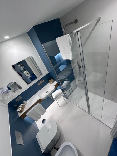 a bathroom with a toilet and a glass shower at Puntaquattroventi in Ercolano