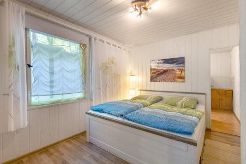 Ένα ή περισσότερα κρεβάτια σε δωμάτιο στο Ferienbungalow 1 in Boitzenburg