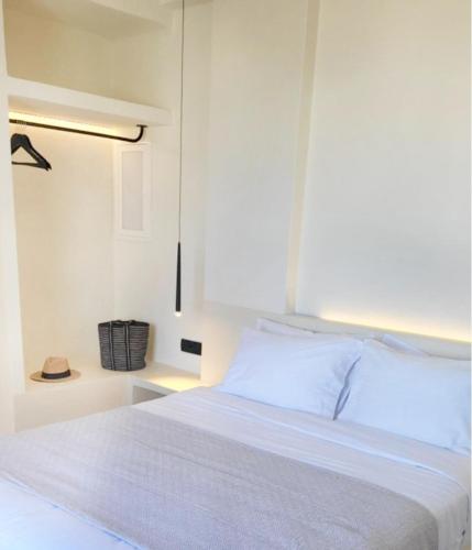 Un ou plusieurs lits dans un hébergement de l'établissement Maeva Suites Santorini