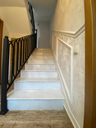 a staircase in a house with blue steps at Boutique Hotel Tiflis in Tbilisi City