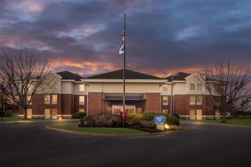 a building with a flag in front of it at Hampton Inn & Suites Newtown in Yardley