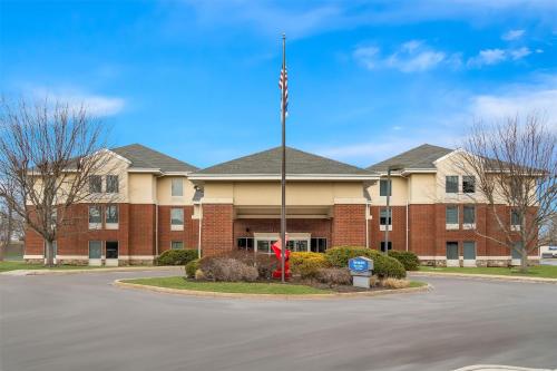 a building with an american flag in front of it at Hampton Inn & Suites Newtown in Yardley