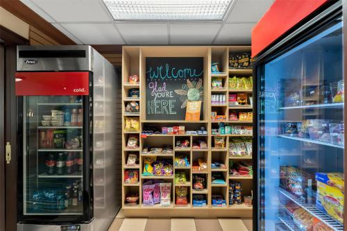 a grocery store with a display case with food at Hampton Inn & Suites Newtown in Yardley