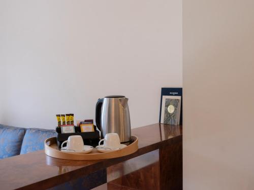 a coffee maker on a counter in a living room at Park Hotel Principe in Lugano